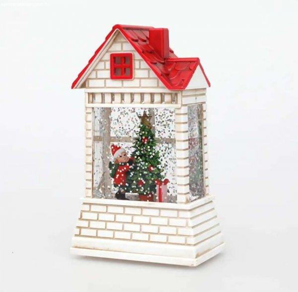 Mikulást és fenyőfát ábrázoló karácsonyi házikó amely világítós és
mozgó hópelyhes