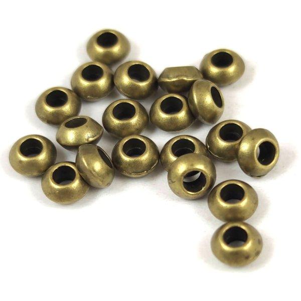 Fémgyöngy - sárgaréz színű - 5.5 x 3mm 